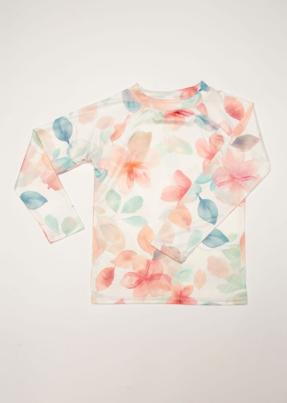 Dziewczynka w T-shircie kąpielowym UPF50+ Bliss Ducksday na plaży