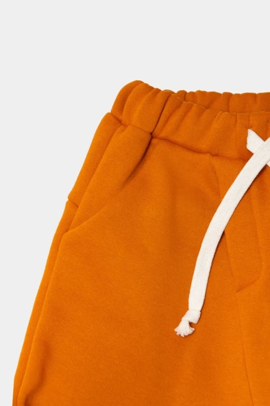 Modne dziecięce spodnie booso 226 CLASSIC WARM PANTS intensywny pomarańcz